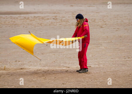 New Brighton, Wallasey, UK.  UK Weather.  30th April, 2017. Sunny with gusty winds in the resort and light windborne sand causing irritation to tourists enjoying the beach promenade at low water. Credit; MediaWorldImages/AlamyLiveNews Stock Photo