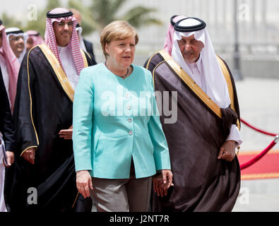 Jeddah, Saudi Arabia. 30th Apr, 2017. German Chancellor Angela Merkel (CDU) is received at the royal terminal of the airport in Jeddah, Saudi Arabia, 30 April 2017. Photo: Kay Nietfeld/dpa/Alamy Live News Stock Photo