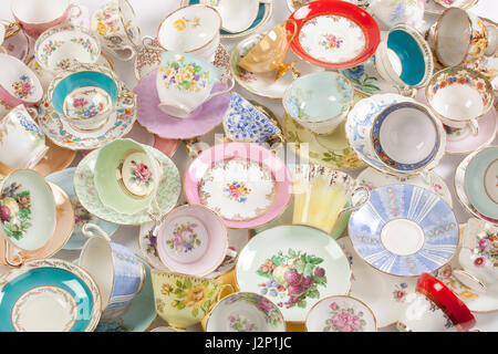 High resolution close-up of a beautiful antique tea cups and saucers collection, isolated on a white background. Stock Photo