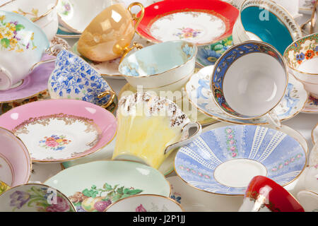 High resolution close-up of a beautiful antique tea cups and saucers collection, isolated on a white background. Stock Photo