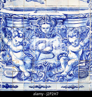 Porto, Portugal - May 13, 2012: Detail of traditional portuguese tilework azulejo on outer wall of the Capela Das Almas De Santa Catarina church in Po Stock Photo