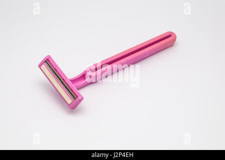Closeup to Old Dirty Used Pink Twin Blades Razor, Isolated Stock Photo