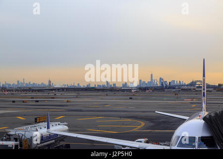 At newark airport, newark, NJ - December 31, 2016: United airlines airplane in the newark airport with new york silhoutte Stock Photo