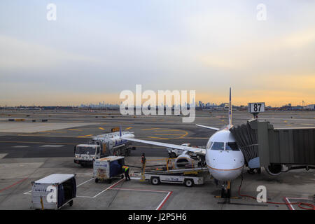 At newark airport, newark, NJ - December 31, 2016: United airlines airplane in the newark airport with new york silhoutte Stock Photo