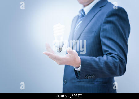 Business man with empty hand. Hand Holding a Light Stock Photo