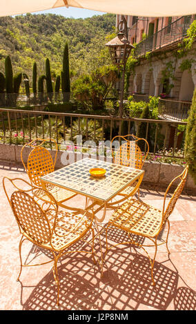 typical French terrace chairs seen at Moltitg-les-Bains Stock Photo