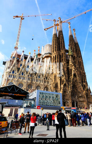 Tourist's wait to enter Antoni Gaudi i Cornet, Gaudi's, La Sagrada Familia modernistic basillica, Barcelona, Catalunya, Spain. Stock Photo