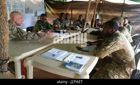 Chaplain (Col.) David Lile (left), the U.S. Army Africa command chaplain, conducts a training for Zambian army and air force chaplain teams at the Nanking army battle training center near Lusaka, Zambia, March 13, 2017. Lile and Sgt. 1st Class George Butler, also assigned the USARAF chaplain section based in Vicenza, Italy, discussed deployment cycle support and spiritual leadership and development components with the Zambian chaplains, who were preparing to deploy to Central African Republic and South Sudan to support service members on extended peacekeeping missions. (Courtesy photo) Stock Photo