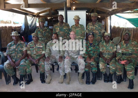 Chaplain (Col.) David Lile (front row, center), the U.S. Army Africa command chaplain, poses for a group photo with Zambian army and air force chaplains at the Nanking army battle training center near Lusaka, Zambia, March 15, 2017. Lile and Sgt. 1st Class George Butler, also assigned the USARAF chaplain section based in Vicenza, Italy, discussed deployment cycle support and spiritual leadership and development components with the Zambian chaplains, who were preparing to deploy to Central African Republic and South Sudan to support service members on extended peacekeeping missions. (Courtesy p Stock Photo