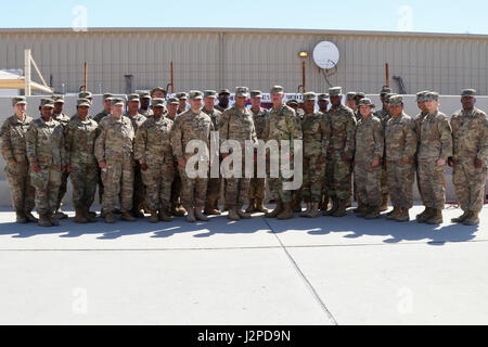 Lt. Gen. Michael Garrett, commanding general of U.S. Army Central and Maj. Gen. William Lee, commanding general of 3rd medical Command stand with the Soldiers of the 3rd Medical Command (Deployment Support) stationed in Qatar to celebrate 25 years of partnership, April 21 at Camp As Sayliyah. The 3rd Medical Command painted a barrier providing a physical tribute to the partnership between the two commands. (U.S. Army photo by Sgt. Bethany Huff, ARCENT Public Affairs) Stock Photo