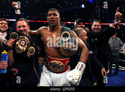 Anthony Joshua celebrates victory over Wladimir Klitschko following the IBF, WBA and IBO Heavyweight World Title bout at Wembley Stadium, London. Stock Photo