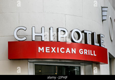 The sign over an entrance to a Chipotle Mexican Grill restaurant in Manhattan. Stock Photo
