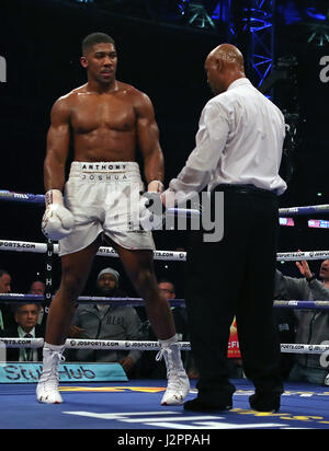 Anthony Joshua is checked on by the ref after being knocked down by Wladimir Klitschko during their IBF, WBA and IBO Heavyweight World Title bout at Wembley Stadium, London. PRESS ASSOCIATION Photo. Picture date: Saturday April 29, 2017. See PA story BOXING London. Photo credit should read: Nick Potts/PA Wire Stock Photo