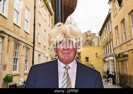 Real size copy of Donald Trump, current US president, in cardboard wearing a blonde wig attached to a street lamp in a street in Bath, UK. Stock Photo
