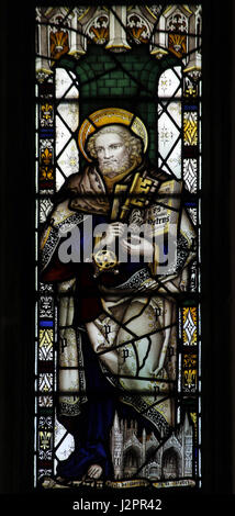 Stained glass window by the Kempe Studios depicting Saint Peter holding the Keys to Heaven and a book Stock Photo