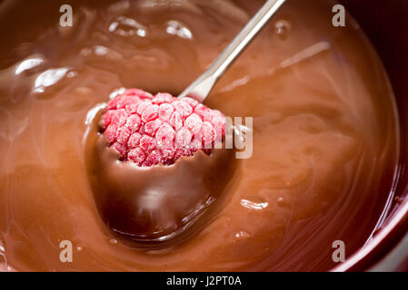 closeup to raspberry and chocolate fondue Stock Photo