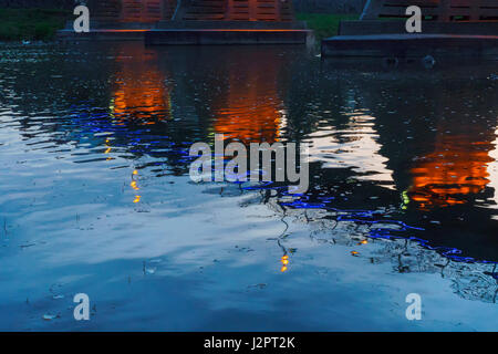 bridge night city reflected in water with lights and reflections. Uzghorod Uzhhorod Stock Photo