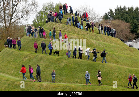 Visitors climb the Snail Mound in the Garden of Cosmic Speculation in the grounds of Portrack House near Dumfries. Stock Photo