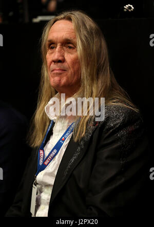Iron Maiden drummer Nicko McBrain watching during day sixteen of the Betfred Snooker World Championships at the Crucible Theatre, Sheffield. Stock Photo