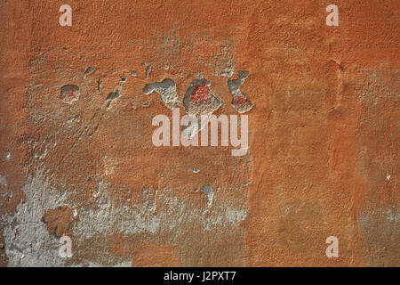 Close up of a stucco painted wall background Stock Photo