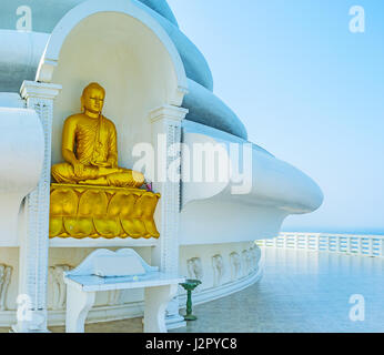 The statue of Buddha, Touching Eart at Japanese Peace Pagoda, located on Rumassala Mount, Unawatuna, Sri Lanka. Stock Photo