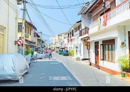 GALLE, SRI LANKA - DECEMBER 4, 2016: The walk along the old streets of Dutch Fort with preserved cottages and churches, on December 4 in Galle. Stock Photo