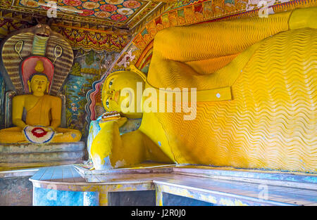 HIKKADUWA, SRI LANKA - DECEMBER 4, 2016: The interior of the Image House of Kumarakanda Rajamaha Vihara Buddhist Temple with colorful statues of Lord  Stock Photo