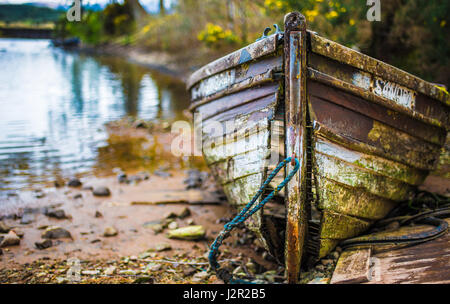 Old fallen apart wooden boat at Gairlochy, Scotland