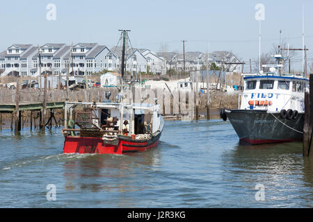 BELFORD, NEW JERSEY - April 11, 2017: A commercial fishing boat returns from sea at the Belford Seafood Cooperative Stock Photo
