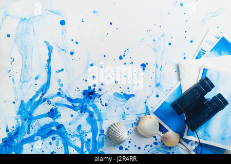 Marine travel flatlay with seashellsand binoculars on a watercolor background Stock Photo