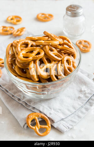 Salty Mini Pretzels with Salt in a Bowl - homemade organic snack for beer Stock Photo