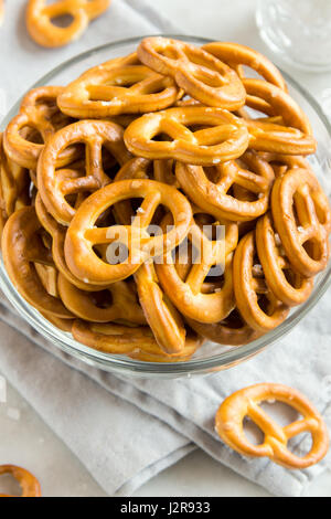 Salty Mini Pretzels with Salt in a Bowl - homemade organic snack for beer Stock Photo