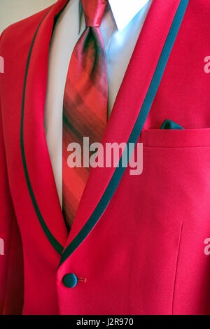 bold red tuxedo with striped silk tie on white shirt Stock Photo