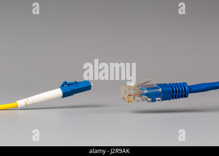 Close-up of optical patch cord lc and copper cable with plug rj45 Stock Photo