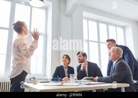 Consulting woman as seminar speaker in business presentation Stock Photo