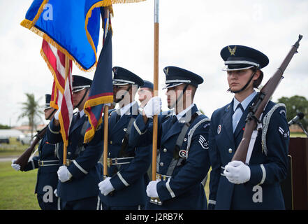 The Andersen Blue Knights Honor Guard team presents the colors during the F-4E Phantom II Rededication Ceremony, April 21, 2017, at Andersen Air Force Base, Guam. The Phantom II was first deployed to the Pacific Air Forces in December 1964, in support of the Vietnam War. (U.S. Air Force photo by Airman 1st Class Christopher Quail/Released) Stock Photo