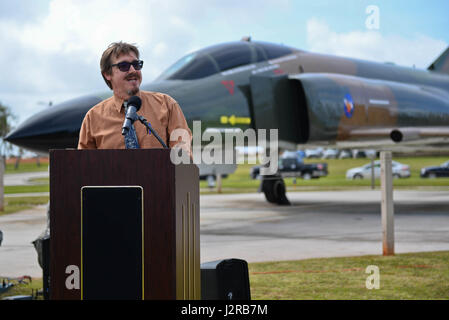 Jeffrey Meyer, 36th Wing Historian, speaks at the F-4E Phantom II Rededication Ceremony, April 21, 2017, at Andersen Air Force Base, Guam. The Phantom II was first deployed to the Pacific Air Forces in December 1964, in support of the Vietnam War. (U.S. Air Force photo by Airman 1st Class Christopher Quail/Released) Stock Photo