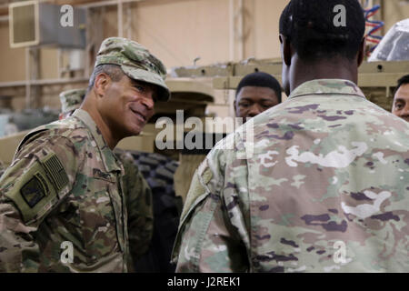 Lt. Gen. Michael Garrett, commanding general of U.S. Army Central, listens to Soldiers of 4th Battalion, 5th Air Defense Artillery Regiment, during a capabilities tour, at Camp Arifjan, April 26. Garrett asked Soldiers about their jobs, their readiness, and their physical fitness levels. (U.S. Army photo by Sgt. Bethany Huff, USARCENT Public Affairs) Stock Photo