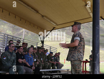 Chief Warrant Officer 2 James Robertson, the battalion gunner for 1st Battalion, 3rd Marine Regiment, speaks to foreign defense attachés during the Operations Orientation Program aboard Marine Corps Base Hawaii, April 26, 2017. The Operations Orientation Program takes many foreign defense attachés on a tour of different regions in the United States giving them exposure to military capabilities, different aspects of American culture, and some of our cities and attractions around the country. (U.S. Marine Corps Photo by Lance Cpl. Matthew Kirk) Stock Photo