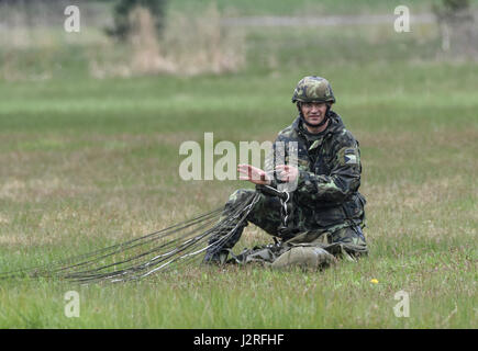 Sky Soldiers from C Company, 2nd Battalion, 503rd Infantry Regiment, 173rd Airborne Brigade conducted a joint airborne operation and airfield seizure with the Czech Republic Army during a joint field exercise as a part of Exercise Saber Junction 17 in Mimon, Czech Republic April 17, 2017. Exercise Saber Junction demonstrates the ability of the 173rd Airborne Brigade to quickly move and assemble its forces in collaboration with NATO allies to secure critical assets, which enables following forces to air land crucial equipment. Stock Photo