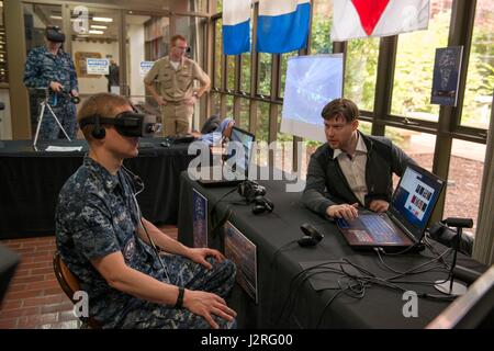 BANGOR, Wash. (April 27, 2017) Sonar Technician 2nd Class Andrew McFarland, assigned to Trident Training Facility (TTF) Bangor, tests the OceanLens, which uses an Oculus Rift virtual reality headset to create a 3D immersive environment for visualizing undersea topography, during the Innovation Lab (iLab) roadshow held at Trident Training Facility Bangor. The iLab, which is located at Naval Submarine Training Center Pacific, in Pearl Harbor, Hawaii, is an initiative launched to spur the rapid development of ideas and concepts to actionable use in submarine warfare. (U.S. Navy photo by Mass Comm Stock Photo