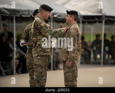 Lt. Gen. James C. McConville, U.S. Army Deputy Chief of Staff, G-1/Personnel, presents the Distinguished Service Medal to Maj. Gen. Thomas C. Seamands as he relinquishes command of U.S. Army Human Resources Command April 28, 2017 in a ceremony at the Lt. Gen. Timothy J. Maude Complex on Fort Knox, Ky. Seamands is headed to the Pentagon in Arlington, Va., for his follow-on assignment. (U.S. Army photo by Sgt. 1st Class Brian Hamilton/ released) Stock Photo