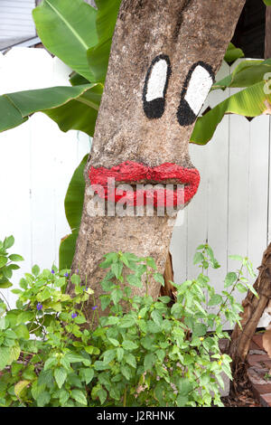 A tree bark painted to have human characteristics. Stock Photo