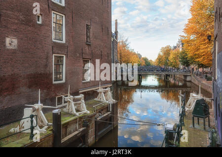 Amsterdam, Netherlands – October 30, 2016: The lock between Сanal Oudezijds Kolk and Oudezijds Voorburgwal in the center of Amsterdam Stock Photo