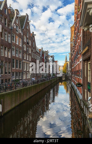 Amsterdam, Netherlands – October 30, 2016: View on the canal Oudezijds Kolk in the center of Amsterdam. Stock Photo