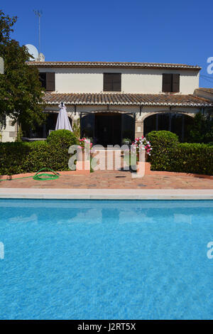 Spanish finca on the Costa Blanca, with swimming pool in foreground Stock Photo