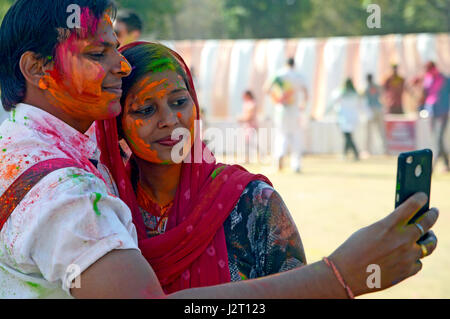 Foreign tourists playing holi in jaipur,India Stock Photo