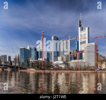Color scenic urban panorama of the financial center of the city of Frankfurt ,Germany, Europe, with the river Main and a bridge in bright  sunlight Stock Photo