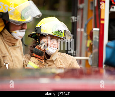 Trainee fire fighter and Howe Sound Secondary student Kei Gray works on a vehicle extraction exercise during the Junior Fire Academy. Stock Photo