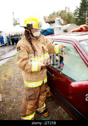 Trainee fire fighter and Howe Sound Secondary student Kei Gray works on a vehicle extraction exercise during the Junior Fire Academy. Stock Photo